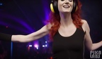 An attractive young redhead woman wearing huge black headphones dancing at a nightclub seed2526030116702505917 edit