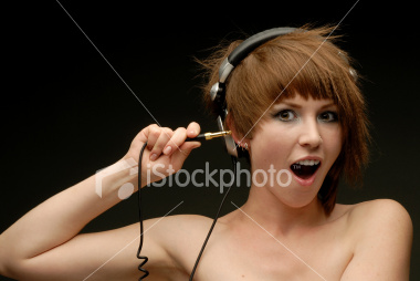 istockphoto 3554458 portrait of girl with earphones sticking patchtip into her ear