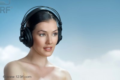 7284198-girl-with-headphones-on-the-sky-background