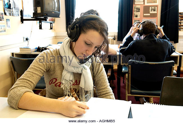 a-teenage-girl-in-a-language-laboratory-concentrating-on-an-as-spanish-aghmb5.jpg