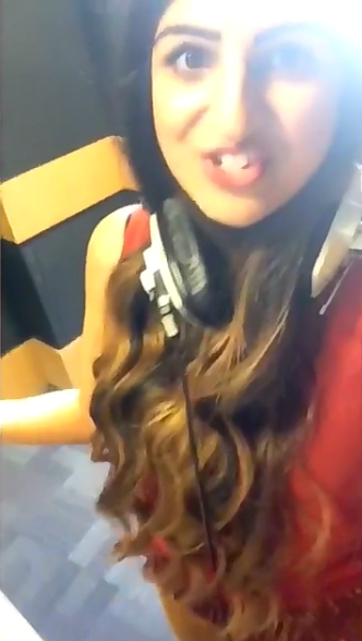girl wearing her big studio headphones around her neck 7.PNG
