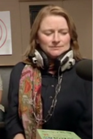 woman wearing big studio headphones around her neck 8